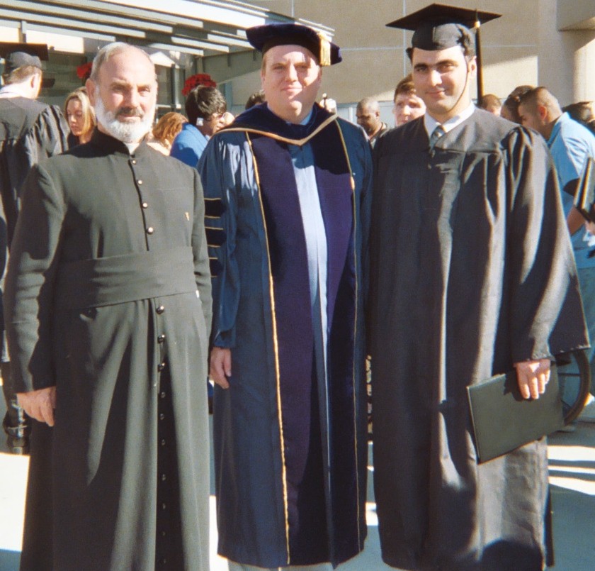 Jihad's father, Keith, and Jihad at graduation